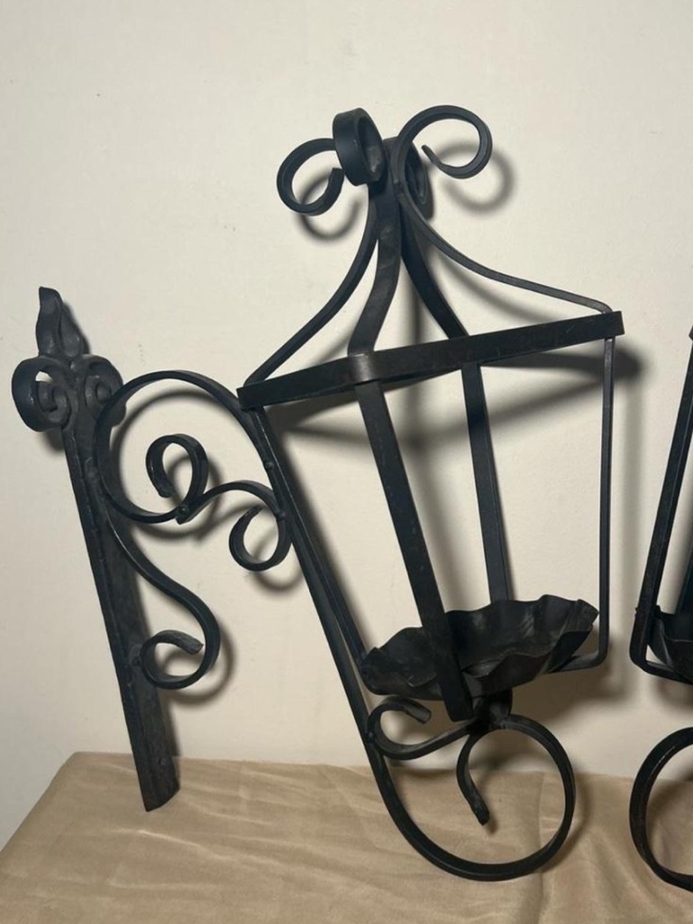 Wrought iron lantern wall sconce